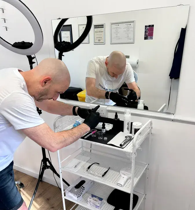Stuart Buckley preparing his equipment at the Micro Magic clinic